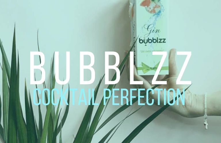 a hand holding a bottle of Gin bubbles next to a plant under the words cocktail perfection