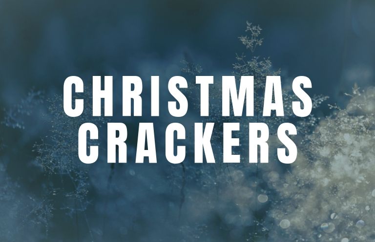 the words Christmas crackers over a picture of frost on plants